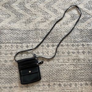 Roots black leather small cross body / over the shoulder. Mint condition